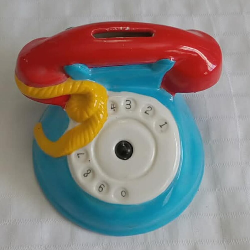 Cute little 1990s ceramic piggy bank in the shape of a vintage telephone